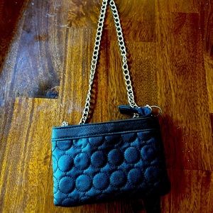 Black small ID size and lip gloss. Perfect for a night out. Keep it simple